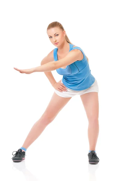 Sportswoman doing stretching exorcises — Stock Photo, Image