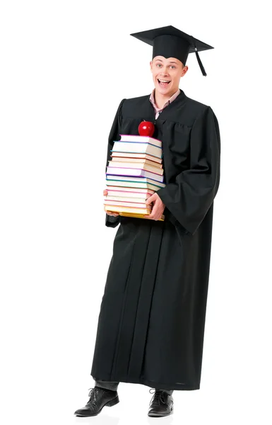 Gediplomeerde student in mantel met boeken — Stockfoto
