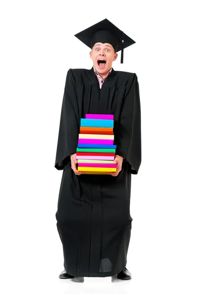 Graduación hombre sosteniendo libros — Foto de Stock