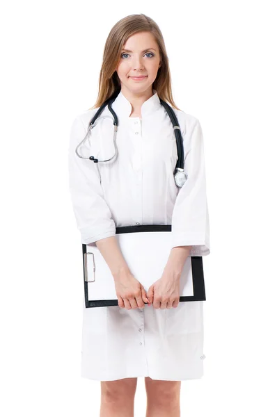 Smiling female doctor holding a clipboard — Stock Photo, Image