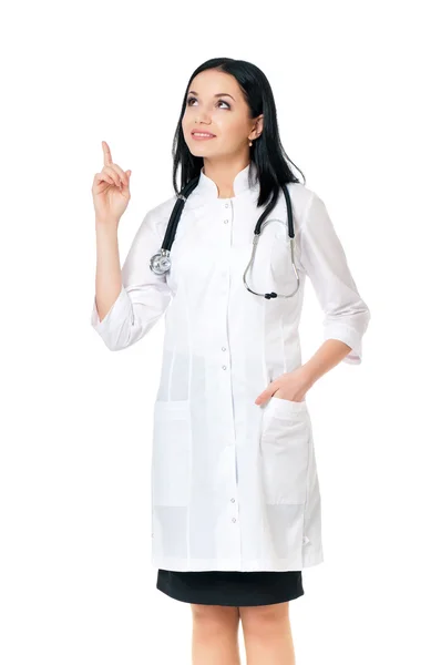 Smiling medical doctor woman with stethoscope showing something — Stock Photo, Image