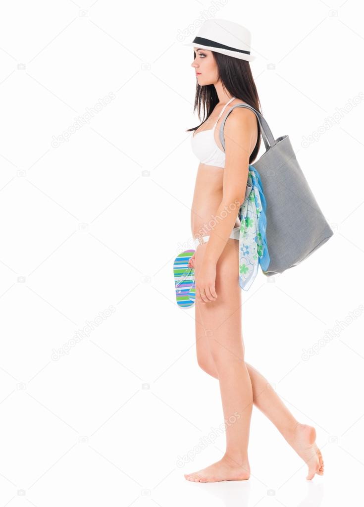 Girl posing in bikini with bag