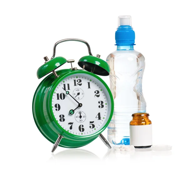 Alarm clock with pills — Stock Photo, Image