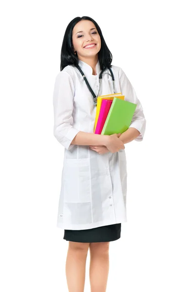Female doctor with stethoscope and books Stock Photo
