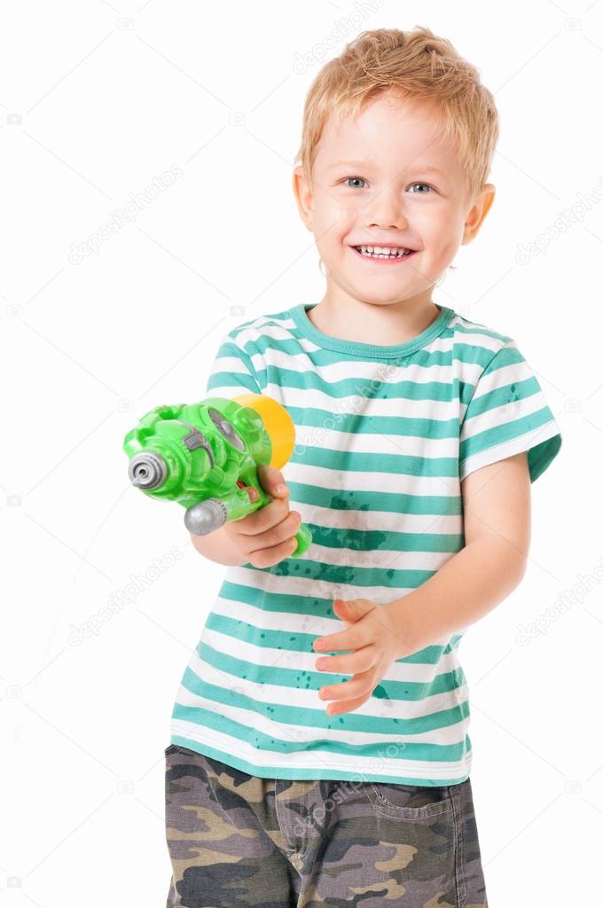 Boy with plastic water gun