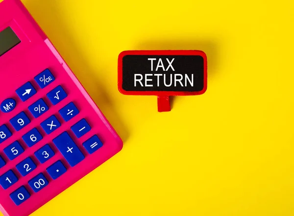 Vista Superior Calculadora Una Etiqueta Con Palabra Tax Return Sobre — Foto de Stock