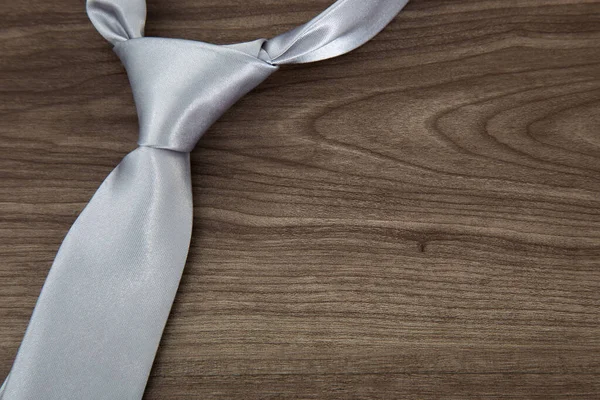 Silver Color Necktie Wooden Table — Stock Photo, Image
