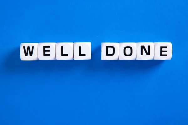 Well done phrase letters on blue background