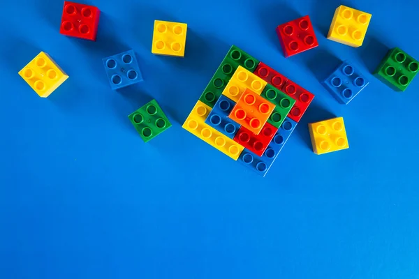 Plastic Building Blocks Blue Background — Stock Photo, Image