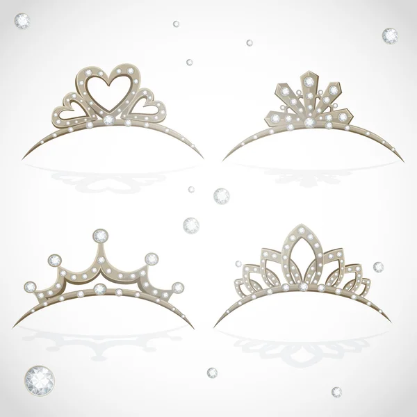Shining gold tiaras with diamonds isolated on a white background — Stock Vector