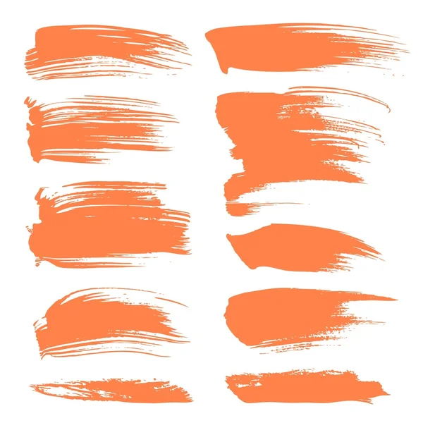 Manchas abstractas de pintura naranja aisladas sobre un fondo blanco — Archivo Imágenes Vectoriales