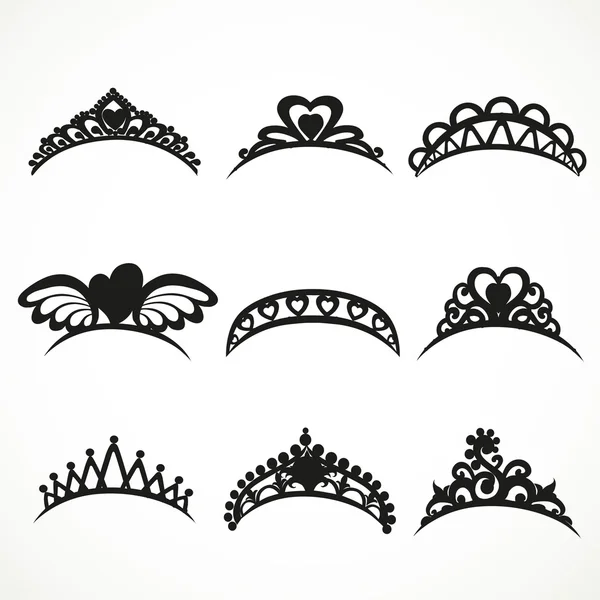 Set  silhouettes of tiaras of various shapes isolated on a white — Stock Vector