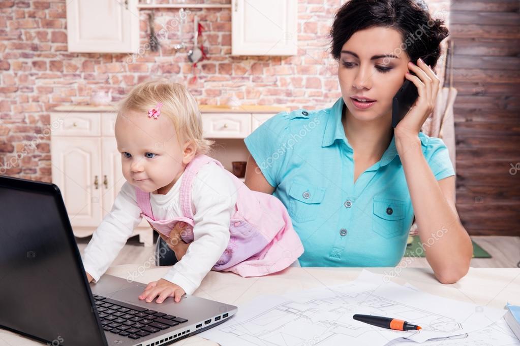 business woman working her baby girl