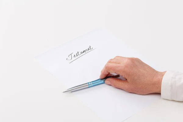 Elderly woman writing testament — Stock Photo, Image