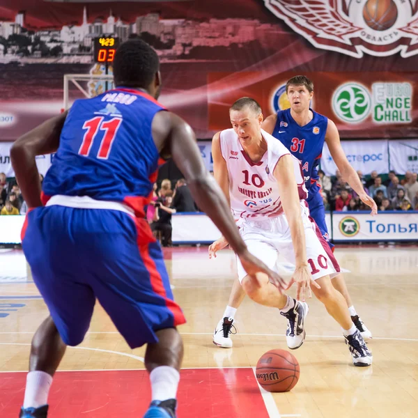 BC Krasnye Krylia forward Yuri Vasilyev (10) drives to the baske Stock Photo