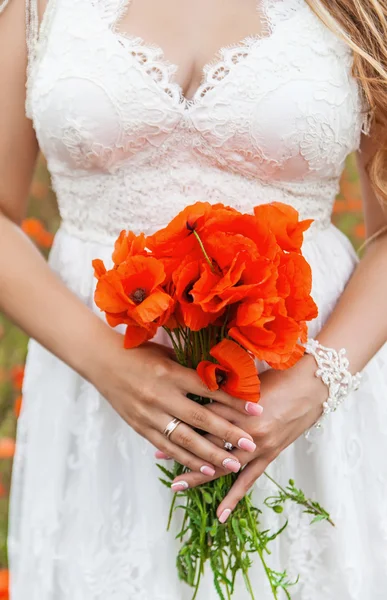 Beautiful wedding bouquet in hands of the bride — Stock Photo, Image