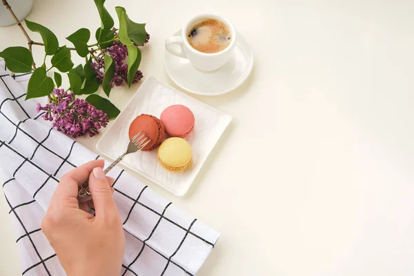 Woman Hand Holds Fork Cup Coffee Cake Macaron Light Table — Stock fotografie