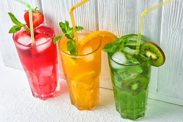 Three Bright Colored Delicious Cold Lemonade Carafes Kiwi Orange Strawberry — Stock Photo, Image