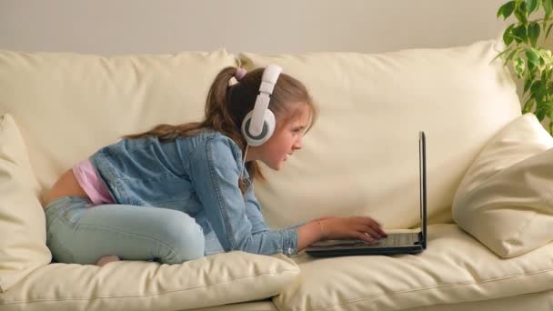 Online Education Upset Tired Kid Girl Headphones Looking Video Lesson — Stock Video