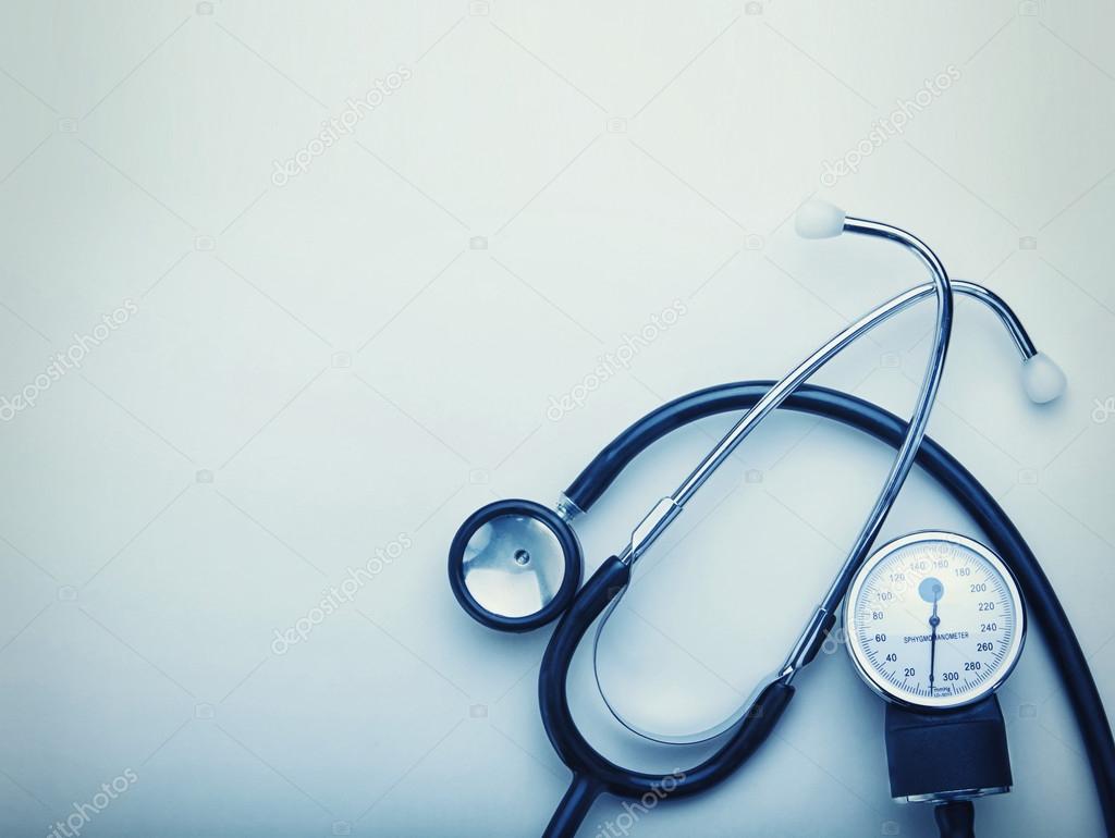 stethoscope on blue background with space for simple text