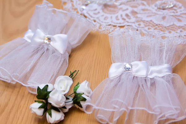 Delicate bride's gloves on the wooden background — Stock Photo, Image
