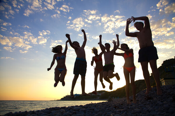 teenagers having fun on the beach