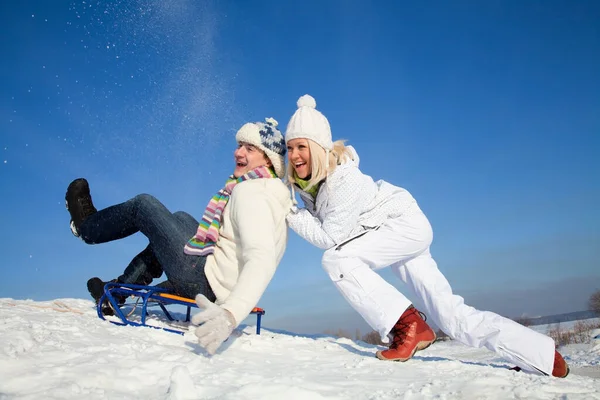 Young Couple Having Fun Riding Sled Snow Resort — Stock Photo, Image