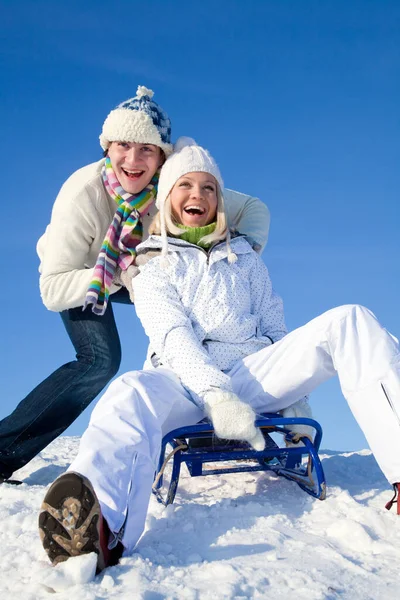 Young Couple Having Fun Riding Sled Winter Resort — Stock Photo, Image