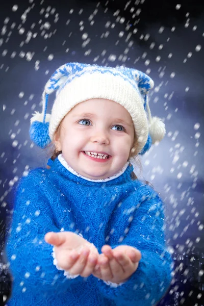 Little winter girl with snowflakes — Stock Photo, Image