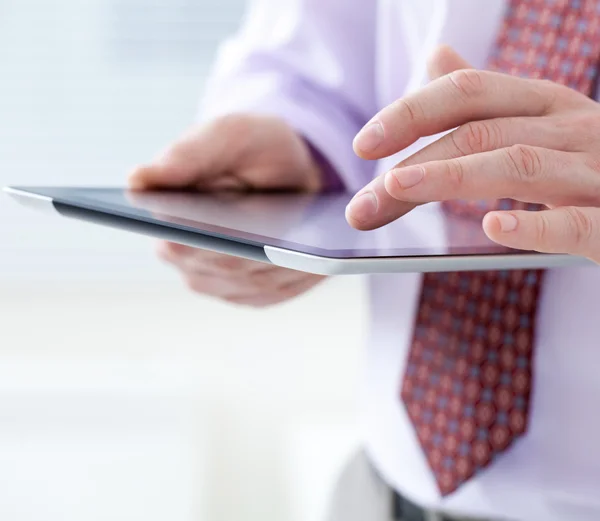 Male hands touching digital tablet — Stock Photo, Image