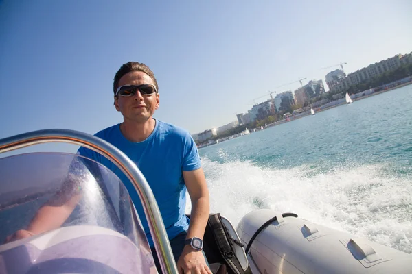 Man rushes inflatable boats — Stock Photo, Image