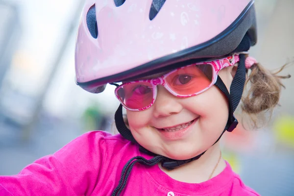 Little girl in helmet on bicycle — Stock Photo, Image