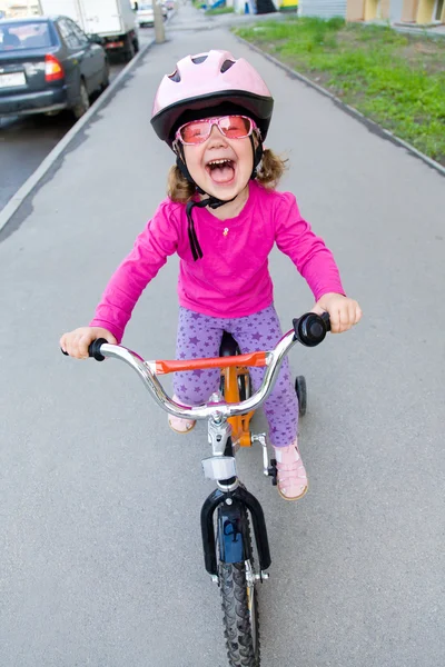 Little girl in helmet on bicycle — Stock Photo, Image