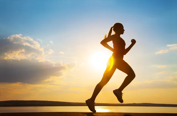 Young Female runner silhouette — Stock Photo, Image