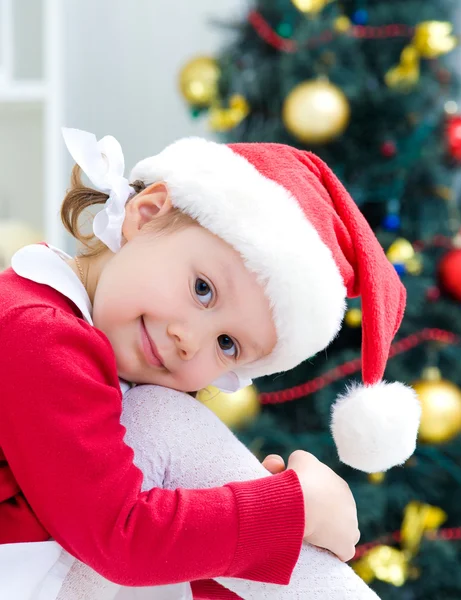 Little girl in Santa hat Royalty Free Stock Images
