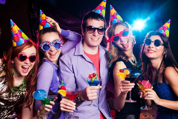 People celebrating the holiday with coctails Royalty Free Stock Photos