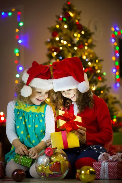 Little girls  open Christmas present Stock Image