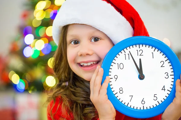 Girl holding big clock Stock Image