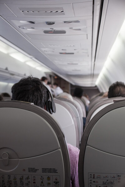 Interior of airplane with passengers 