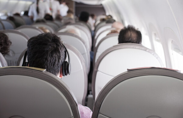 Interior of airplane with passengers 