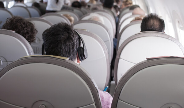 Interior of airplane with passengers 