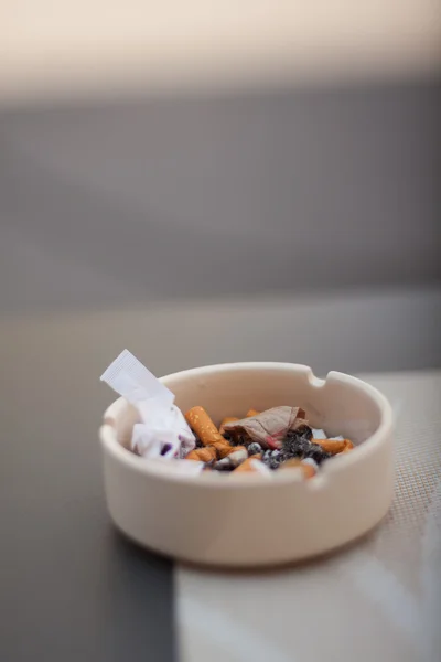 Burned cigarette in ashtray — Stock Photo, Image
