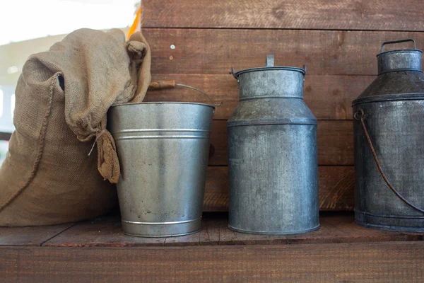 Jute bag and iron bucket — Stock Photo, Image