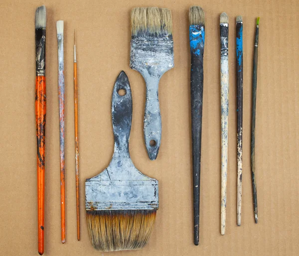 Paintbrushes  on cardboard — Stock Photo, Image