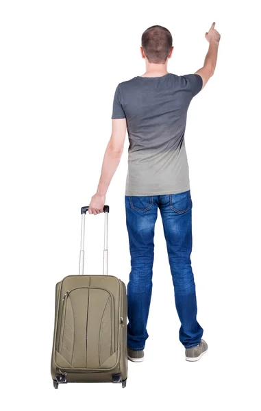 Pointing  man  with suitcase. — Stock Photo, Image