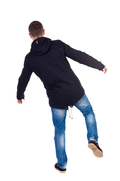 Balancing young man. or dodge the falling . — Stockfoto