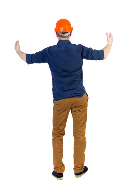 Back view of builder in helmet shows thumbs up — Stock Photo, Image