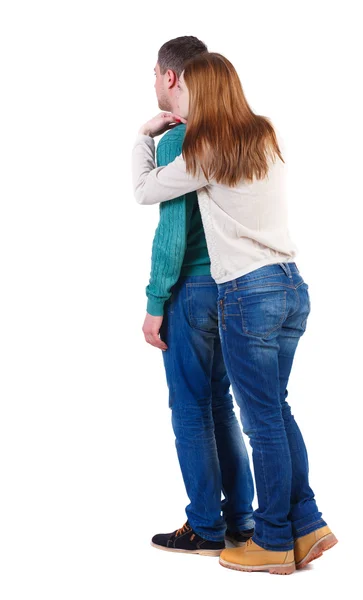 Back view of young embracing couple hug and look — Stock Photo, Image