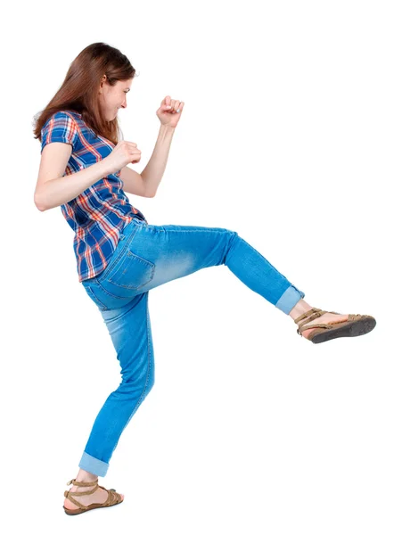 Back view of woman funny fights waving his arms and legs. — Stock Photo, Image