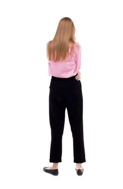 arkadan görünüşü duran genç güzel kadın.